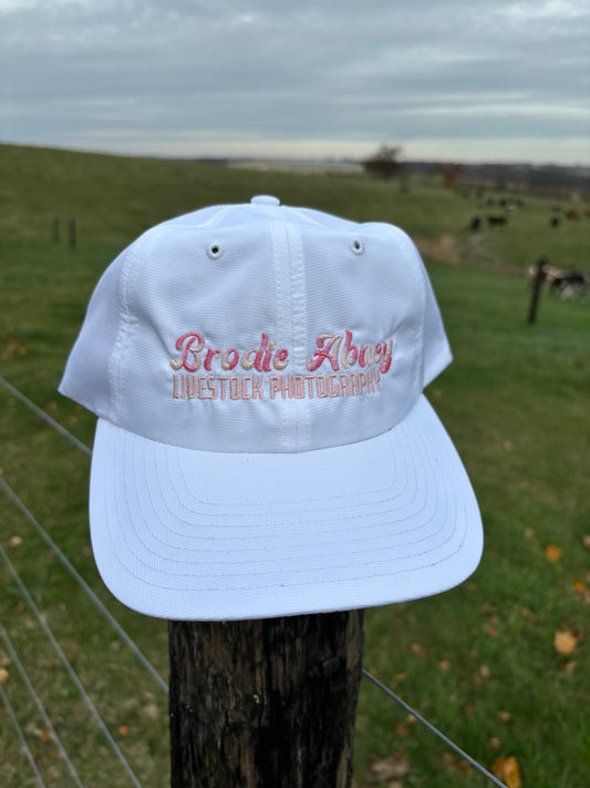 White hat with multicolor pink stitch